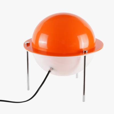 Astra sphere table lamp with solid orange globe shade floating on three slender metal legs
