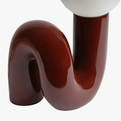 Aurelo Dark Cherry sculptural lamp base detail with curved metal stem