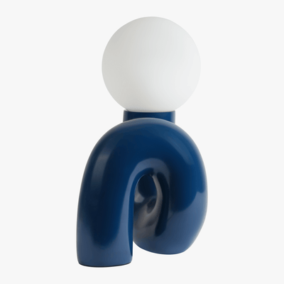 Aurelo Midnight Blue sculptural lamp side view showing the hand-curved metal base