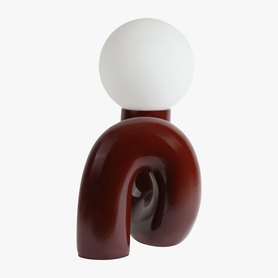 Aurelo Dark Cherry sculptural lamp side view showing the hand-curved metal base