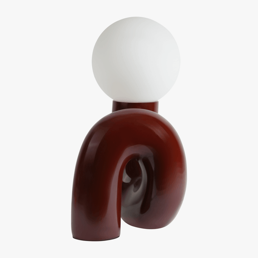 Aurelo Dark Cherry sculptural lamp side view showing the hand-curved metal base