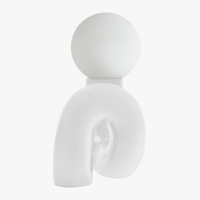 Aurelo White sculptural lamp side view showing the hand-curved metal base