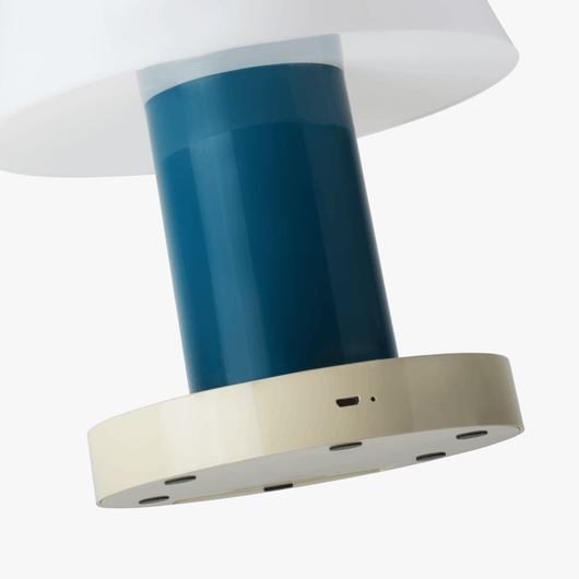 Linn cordless table lamp with compact silhouette, rechargeable battery base, and warm light tone