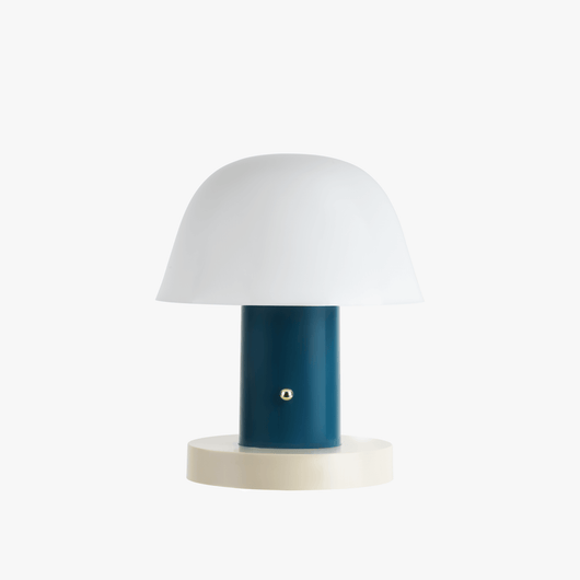 Linn cordless table lamp with compact silhouette, rechargeable battery base, and warm light tone