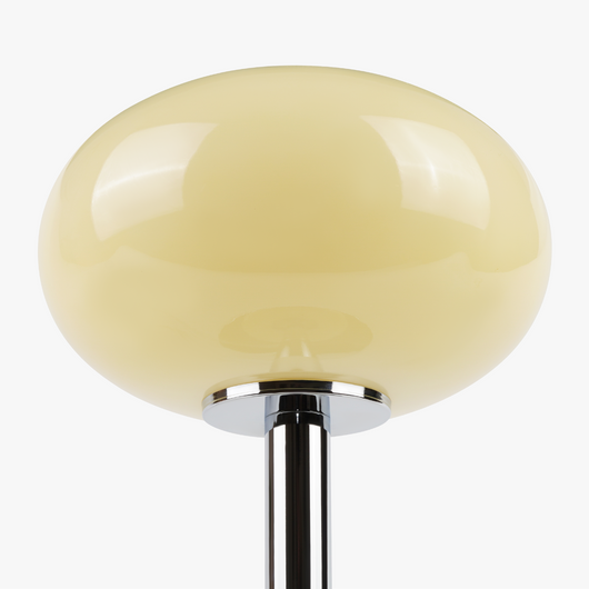 Selene glass table lamp with smooth glass globe shade on a weighted solid metal base