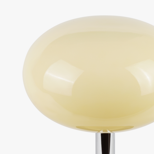 Selene glass table lamp with smooth glass globe shade on a weighted solid metal base