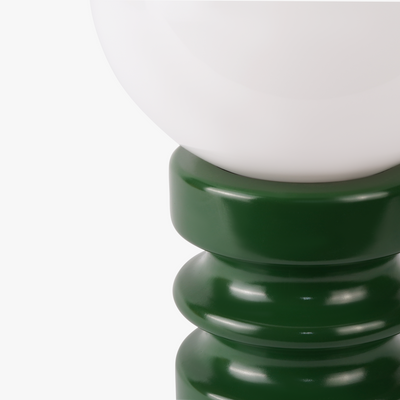 Luma glass table lamp with frosted glass globe shade on a weighted compact base