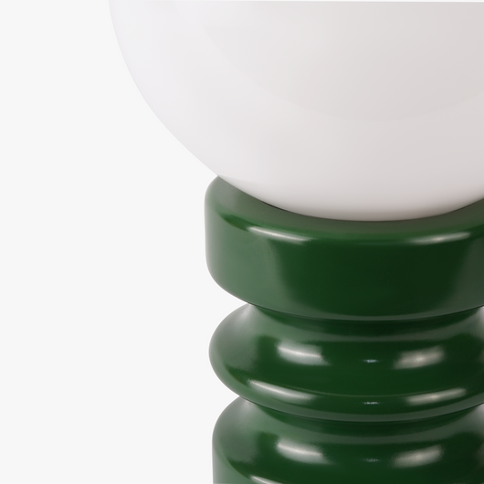 Luma glass table lamp with frosted glass globe shade on a weighted compact base