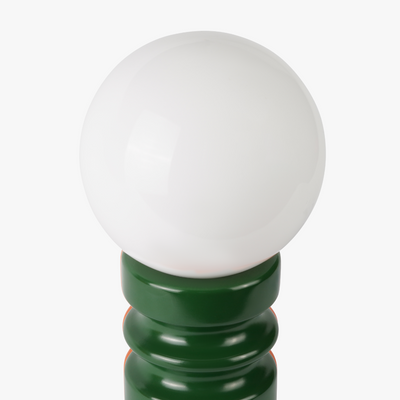 Luma glass table lamp with frosted glass globe shade on a weighted compact base