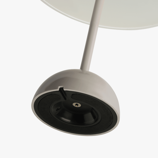 Mio cordless lamp with gentle bell silhouette, painted body, and rechargeable battery design