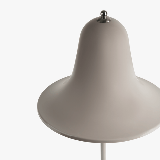 Mio cordless lamp with gentle bell silhouette, painted body, and rechargeable battery design