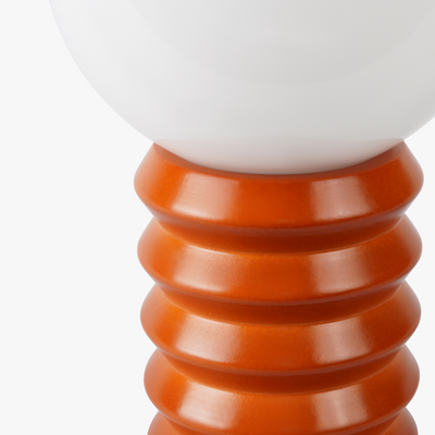Maren glass globe table lamp with frosted shade on a sculpted wooden base