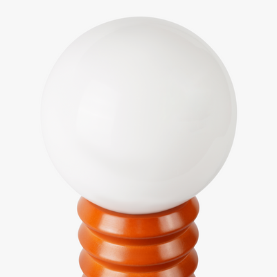 Maren glass globe table lamp with frosted shade on a sculpted wooden base