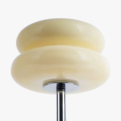 Verdon Buttercream Yellow macaron lamp stained glass shade close-up showing the warm tinted glow
